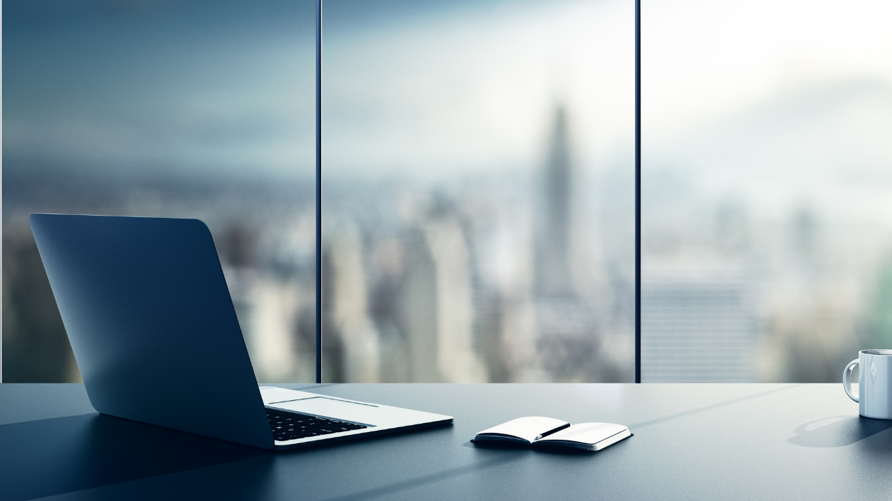 Empty desk with a laptop